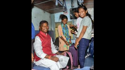 Union tribal affairs minister Arjun Munda sees off the girls bound for Tamil Nadu. (PTI) Union tribal affairs minister Arjun Munda sees off the girls bound for Tamil Nadu. (PTI)