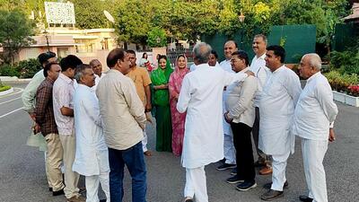 Gehlot (back to camera) meets ministers and MLAs in Jaipur. (ANI) Gehlot (back to camera) meets ministers and MLAs in Jaipur. (ANI)