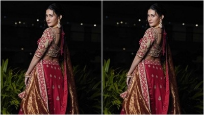 Amyra dressed up as a bride in a red blouse heavily embellished in golden zari details. She further teamed it with a long and flowy red silk skirt that came embellished in golden zari. (Instagram/@amyradastur93) Amyra dressed up as a bride in a red blouse heavily embellished in golden zari details. She further teamed it with a long and flowy red silk skirt that came embellished in golden zari. (Instagram/@amyradastur93)