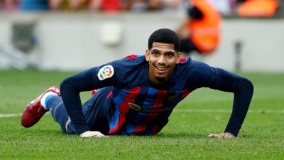 Barcelona's Ronald Araujo reacts after falling to the ground during a Spanish La Liga soccer match between FC Barcelona and Elche CF at Camp Nou stadium in Barcelona, Spain (AP)