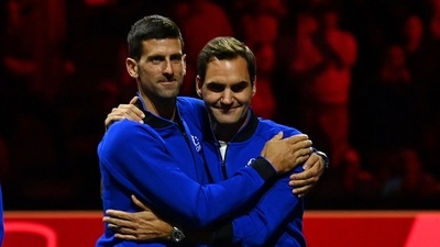 Serbia's Novak Djokovic (L) embraces Switzerland's Roger Federer (R) at the presentation ceremony Serbia's Novak Djokovic (L) embraces Switzerland's Roger Federer (R) at the presentation ceremony