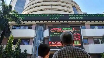People watch the Sensex on a screen outside Bombay Stock Exchange (BSE) in Mumbai.&nbsp; (PTI file)