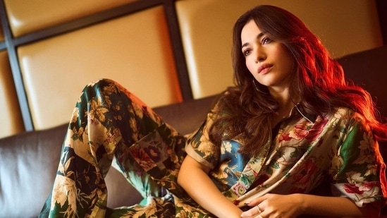 She recently dropped a series of images of herself in a quirky floral shirt and pants set.(Instagram/@tamannaahspeaks)