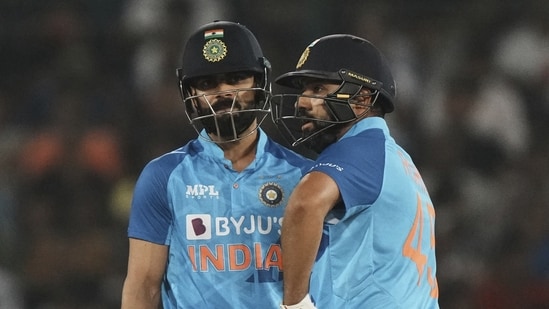 Rohit Sharma, right, and Virat Kohli stand between the wickets during the third T20 cricket match between India and Australia(AP)