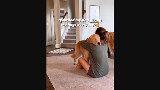 The image, taken from the Instagram video, shows the Golden Retriever hugging its pet mom.(Instagram/@goldie.swag)