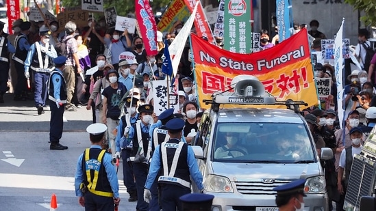Shinzo Abe State Funeral: Protesters take part in a demonstration against the state funeral for Japan's former prime minister Shinzo Abe in Tokyo.(AFP)