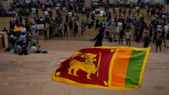 Sri Lanka-Singapore Deal: A Sri Lankan flag is waved in Colombo, Sri Lanka.