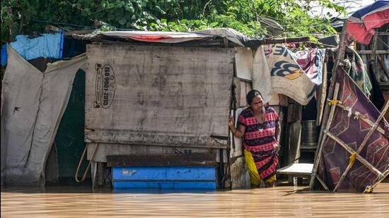 A resident at her shanty in a flooded low lying area as water level of Yamuna river crosses the danger mark, in New Delhi, Tuesday. (PTI) A resident at her shanty in a flooded low lying area as water level of Yamuna river crosses the danger mark, in New Delhi, Tuesday. (PTI)