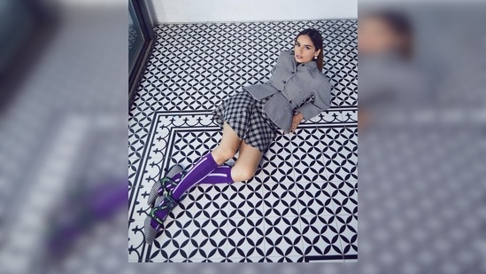 Manushi Chhillar amped up her look by pairing her outfit with purple striped knee-length socks and matching checkered kitten heels.(Instagram/@manushi_chhillar)