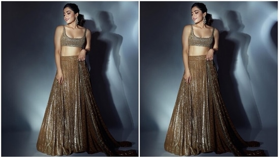 Rashmika wore the blouse with a matching lehenga decked with heavy sequin embellishments, several pleats falling from the waistband to form an A-line silhouette, heavily layered ghera, and a floor-grazing hem length.(Instagram)