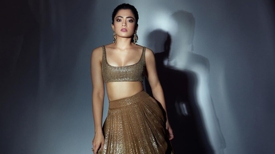 Recently, Rashmika Mandanna took to Instagram to share pictures from a photoshoot. The images showed the star serving glamorous poses for the camera, dressed in a golden lehenga choli. She donned the outfit to promote her film Goodbye. "Today I am the golden girl. How cool. Do you approve of this look? #Goodbye," Rashmika captioned her post.(Instagram)