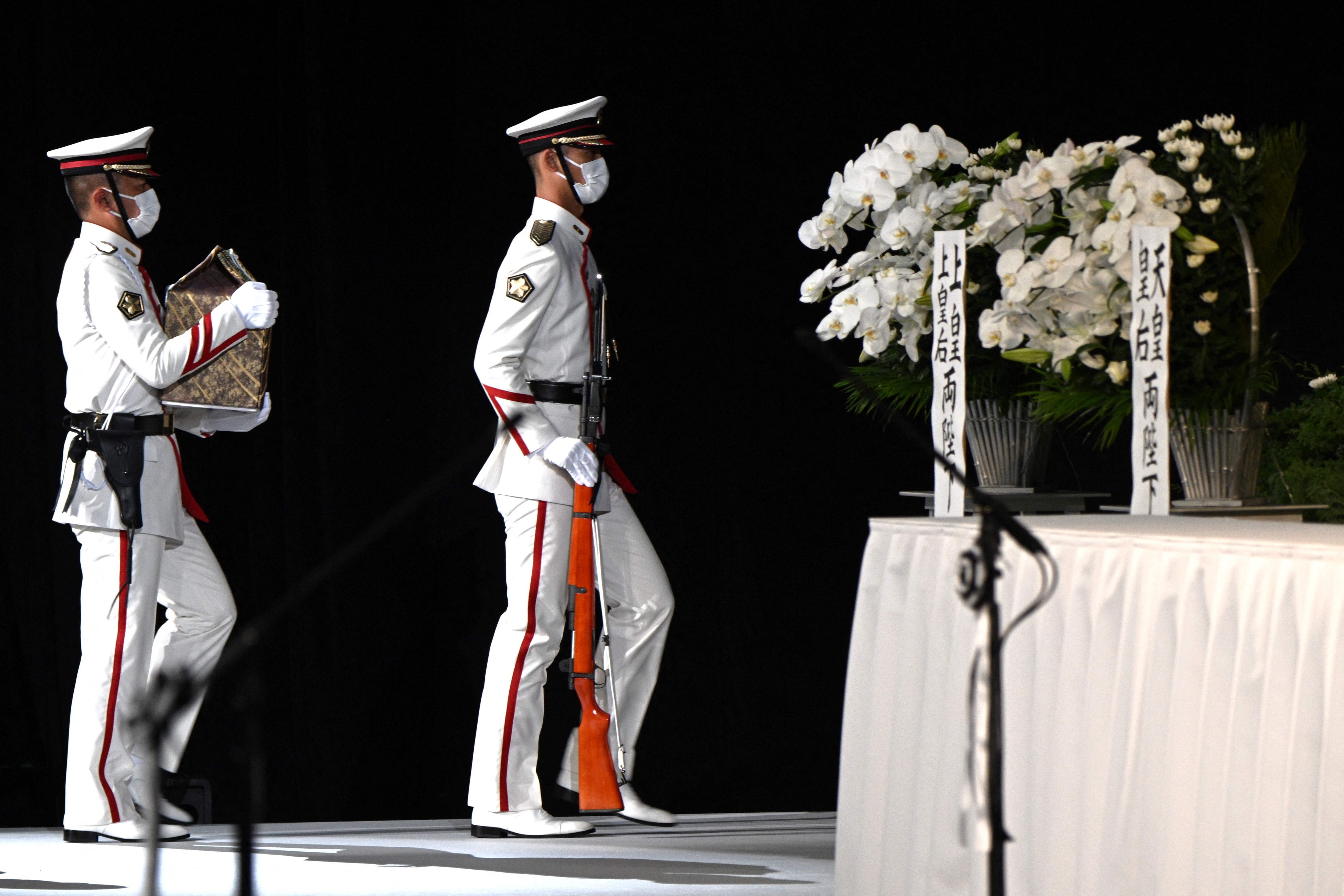 Members of an honour guard carry the ashes of former Japanese prime minister Shinzo Abe to the altar during the start of his state funeral. (AFP) Members of an honour guard carry the ashes of former Japanese prime minister Shinzo Abe to the altar during the start of his state funeral. (AFP)