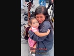 The image, taken from the Instagram video, shows the kid hugging the busker after her performance.(Instagram/@sshanilee)