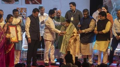 Mumbai, India - September 28, 2022: Maharashtra Chief Minister Eknath Shinde and Deputy Chief Minister Devendra Fadnavis present the Lata Mangeshkar Award to Usha Mangeshkar during the inauguration ceremony of Bharat Ratna Lata Mangeshkar International Music Academy, at Ravindra Natya Mandir, Prabhadevi, in Mumbai, India, on Wednesday, September 28, 2022. (Photo by Pratik Chorge/Hindustan Times) (Pratik Chorge/HT PHOTO) Mumbai, India - September 28, 2022: Maharashtra Chief Minister Eknath Shinde and Deputy Chief Minister Devendra Fadnavis present the Lata Mangeshkar Award to Usha Mangeshkar during the inauguration ceremony of Bharat Ratna Lata Mangeshkar International Music Academy, at Ravindra Natya Mandir, Prabhadevi, in Mumbai, India, on Wednesday, September 28, 2022. (Photo by Pratik Chorge/Hindustan Times) (Pratik Chorge/HT PHOTO)