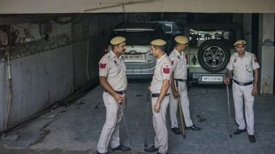 Police personnel deployed at Popular Front of India (PFI) office building, at Shaheen Bagh in New Delhi, Wednesday. The centre has imposed a ban on the organisation and several of its associates for their alleged terror activities. (PTI) Police personnel deployed at Popular Front of India (PFI) office building, at Shaheen Bagh in New Delhi, Wednesday. The centre has imposed a ban on the organisation and several of its associates for their alleged terror activities. (PTI)