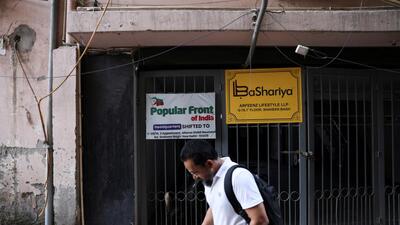 A man walks past the old office of Popular Front of India (PFI) Islamic group, in New Delhi, India, September 28, 2022. (REUTERS)