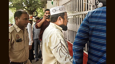 Aneesh, an accused detained during a raid by Special Cell of the Delhi Police for his alleged association with Popular Front of India (PFI), being taken to a police station, New Delhi, September 27, 2022 (PTI)