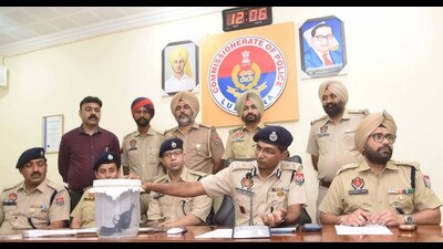 Police commissioner Kaustubh Sharma and other senior police officials discussing the arrest of the two men involved in shooting a factory worker dead with mediapersons on Wednesday. (Gurpreet Singh/’HT) Police commissioner Kaustubh Sharma and other senior police officials discussing the arrest of the two men involved in shooting a factory worker dead with mediapersons on Wednesday. (Gurpreet Singh/’HT)