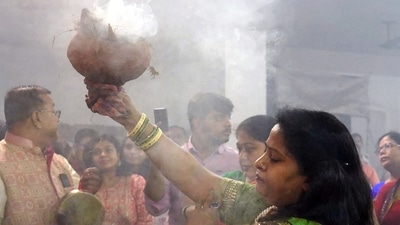 Devotees hold two or more burning earthen pots - two in their hands and one in their mouth and dance in sync with the beats of Dhak. (ANI) Devotees hold two or more burning earthen pots - two in their hands and one in their mouth and dance in sync with the beats of Dhak. (ANI)