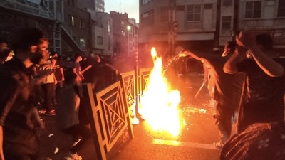 Iran Anti-Hijab Protests: Iran, protesters make fire and block the street during a protest. (AP)