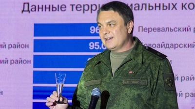 Leonid Pasechnik, leader of self-proclaimed Luhansk People's Republic, toasts as he speaks to journalists after a referendum in Luhansk, Ukraine, Tuesday. (AP) Leonid Pasechnik, leader of self-proclaimed Luhansk People's Republic, toasts as he speaks to journalists after a referendum in Luhansk, Ukraine, Tuesday. (AP)
