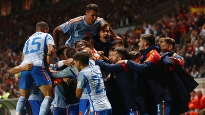 Spain's Alvaro Morata celebrates scoring their first goal with teammates (REUTERS)