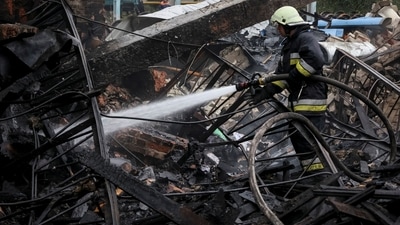 Russia-Ukraine War: Ukrainian firefighter works at destroyed by Russian military strike freight railway station, amid Russia's attack on Ukraine, in Kharkiv. (Reuters)