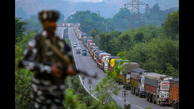 Stranded trucks on the Jammu & Kashmir National highway which was closed due to shooting stones in Ramban area, in Jammu, Wednesday. (PTI)