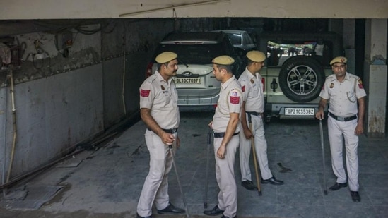 Police personnel deployed at Popular Front of India (PFI) office building, at Shaheen Bagh in New Delhi, Wednesday. The centre has imposed a ban on the organisation and several of its associates for their alleged terror activities. (PTI)