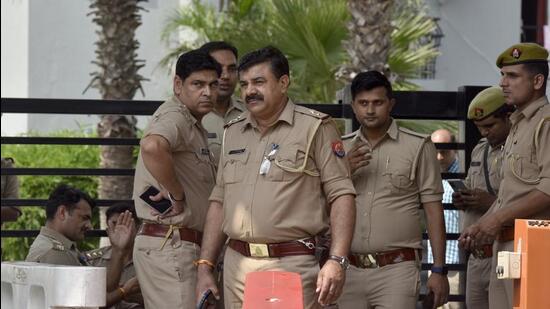 Noida, India - September 28, 2022: Police personnel deployed during a protest by the members of Tyagi community outside the society. Around 50 people are sitting outside with mattresses and cooking supplies until the matter is resolved and the trees are left as is, in Noida, India, on Wednesday, September 28, 2022. (Photo by Sunil Ghosh / Hindustan Times) (Sunil Ghosh/ HT) Noida, India - September 28, 2022: Police personnel deployed during a protest by the members of Tyagi community outside the society. Around 50 people are sitting outside with mattresses and cooking supplies until the matter is resolved and the trees are left as is, in Noida, India, on Wednesday, September 28, 2022. (Photo by Sunil Ghosh / Hindustan Times) (Sunil Ghosh/ HT)
