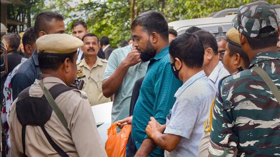 A member of Popular Front of India (PFI) being produced in a court in Guwahati on Tuesday. (PTI)