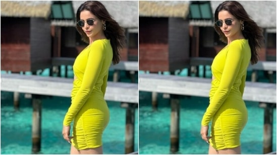 Aamna picked a bright neon green dress as she posed by a resort. With the wind in the hair and smile on her face, she gave us new fashion goals.(Instagram/@aamnasharifofficial)