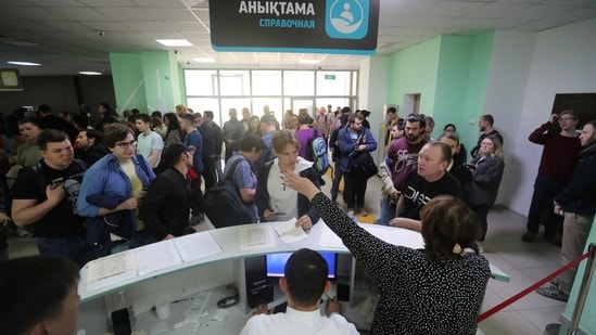 Russia-Ukraine War: Russian citizens visit a public service centre to receive an individual identification number for foreigners in Kazakhstan.(Reuters)