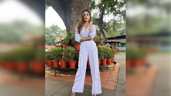 Rhea Chakraborty accessorised her look with a big black belt and paired her outfit with black square-toe stilettoes.(Instagram/@rhea_chakraborty)