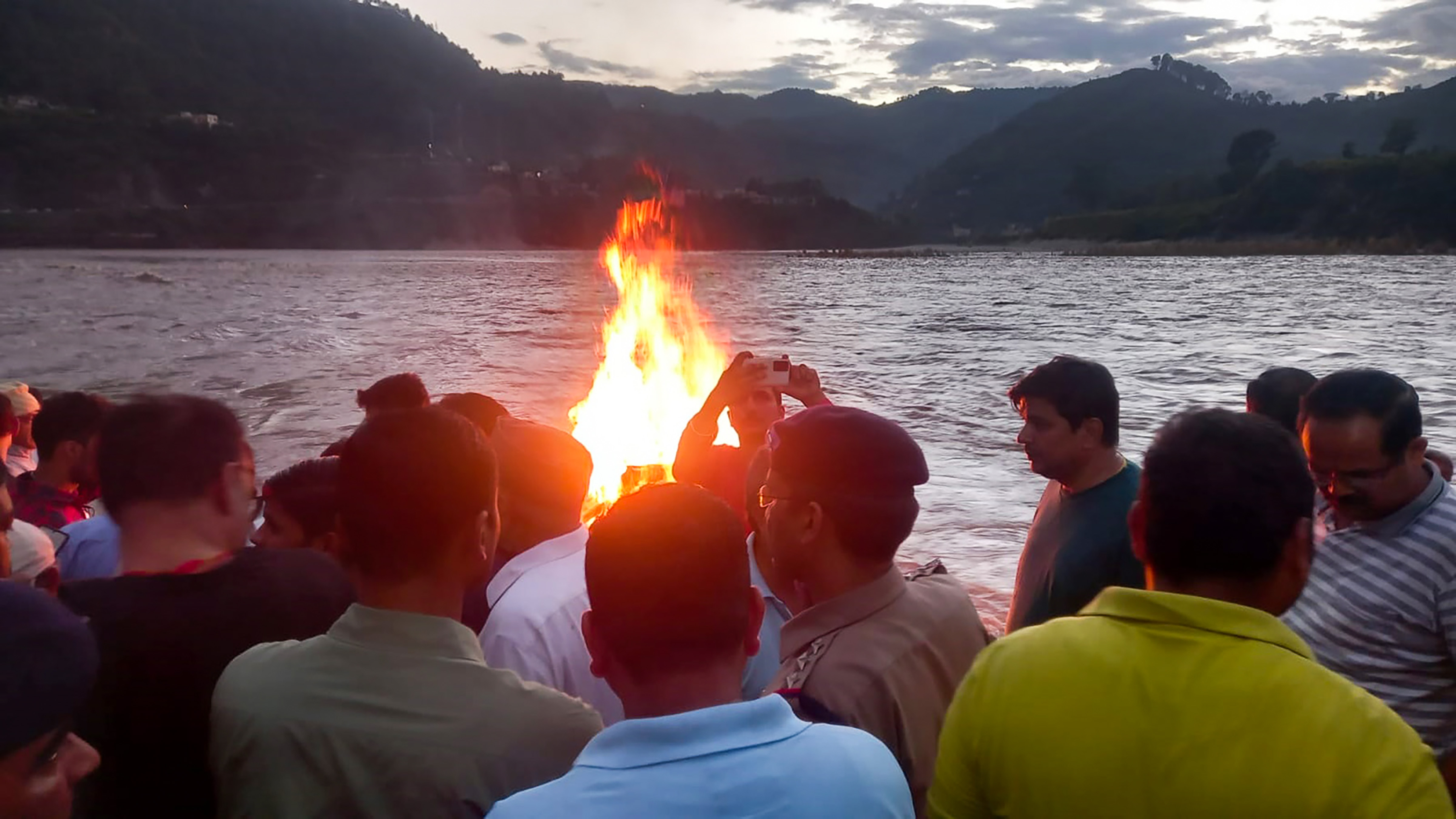 Family members and relatives of Ankita Bhandari during her cremation at ITI Ghat, at Srinagar in Pauri Garhwal district. (PTI) Family members and relatives of Ankita Bhandari during her cremation at ITI Ghat, at Srinagar in Pauri Garhwal district. (PTI)