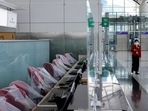Covid In Hong Kong: A crew member of Cathay Pacific walks at the Hong Kong International Airport Departure Hall.