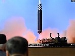 North Korea Missile: People watch a television screen showing a news broadcast with file footage of a North Korean missile test. North Korea Missile: People watch a television screen showing a news broadcast with file footage of a North Korean missile test.