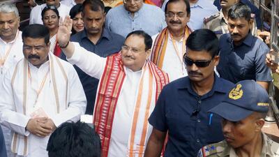 Bhubaneswar: BJP president JP Nadda waves to the supporters after being welcomed by party leaders and supporters art Biju Patnaik International airport on Thursday. (ANI) Bhubaneswar: BJP president JP Nadda waves to the supporters after being welcomed by party leaders and supporters art Biju Patnaik International airport on Thursday. (ANI)
