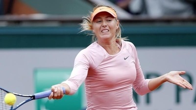 Maria Sharapova of Russia serves to compatriot Ksenia Pervak during their first round match for the French Open tennis tournament at Roland Garros in Paris (EPA Photo) Maria Sharapova of Russia serves to compatriot Ksenia Pervak during their first round match for the French Open tennis tournament at Roland Garros in Paris (EPA Photo)
