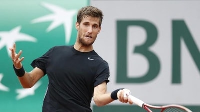 Martin Klizan of Slovakia returns to Kei Nishikori of Japan during their first round match for the French Open tennis tournament at Roland Garros in Paris (EPA Photo) Martin Klizan of Slovakia returns to Kei Nishikori of Japan during their first round match for the French Open tennis tournament at Roland Garros in Paris (EPA Photo)