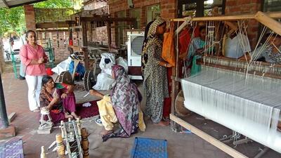 Kirandeep Kaur (left) provides material and resources to underprivileged women living near her ancestral village, Balwaar Khurd, to weave rugs, blankets etc, and then sells it online. (HT Photo) Kirandeep Kaur (left) provides material and resources to underprivileged women living near her ancestral village, Balwaar Khurd, to weave rugs, blankets etc, and then sells it online. (HT Photo)