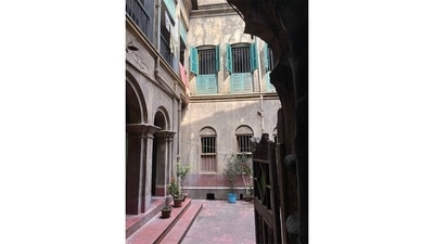 Barrister Babur Bari (Barrister’s Home) has been housed by the same family since before the Revolt of 1857. It is characterised by its large courtyard, arched corridors and slatted French windows (seen here). It is the ancestral home of Krishnakali Basu (Mitra), a Gurgaon-based theatre artiste who is struggling to hold out against it being sold, demolished and replaced by a high-rise. (Image Courtesy: Calcutta Houses) Barrister Babur Bari (Barrister’s Home) has been housed by the same family since before the Revolt of 1857. It is characterised by its large courtyard, arched corridors and slatted French windows (seen here). It is the ancestral home of Krishnakali Basu (Mitra), a Gurgaon-based theatre artiste who is struggling to hold out against it being sold, demolished and replaced by a high-rise. (Image Courtesy: Calcutta Houses)