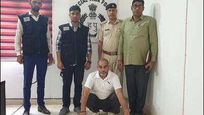 Joginder Khatana in police custody. (HT Photo) Joginder Khatana in police custody. (HT Photo)