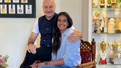 Anupam Kher with PV Sindhu at her house.