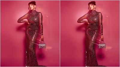 Nora looked every bit gorgeous in the pink gown that came with silver mirror work details throughout. The bodycon gown with a turtle neck and full sleeves, hugged her shape and showed off her curves. (Instagram/@notafatehi) Nora looked every bit gorgeous in the pink gown that came with silver mirror work details throughout. The bodycon gown with a turtle neck and full sleeves, hugged her shape and showed off her curves. (Instagram/@notafatehi)