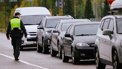Russia-Ukraine War: A border guard officer controls the vehicles entering Finland at the border checkpoint crossing in Vaalimaa, Finland. (AFP)