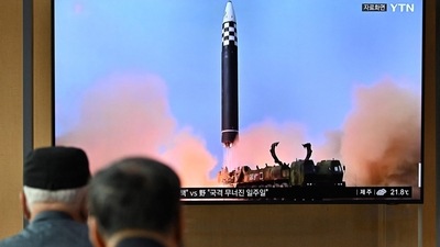 North Korea Missile: People watch a television screen showing a news broadcast with file footage of a North Korean missile test. (AFP File) North Korea Missile: People watch a television screen showing a news broadcast with file footage of a North Korean missile test. (AFP File)