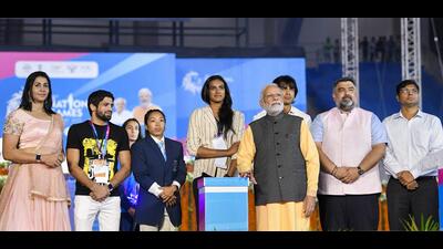 Prime Minister Narendra Modi with PV Sindhu, Neeraj Chopra and others during inauguration of 36th National Games in Ahmedabad, Thursday (PIB) Prime Minister Narendra Modi with PV Sindhu, Neeraj Chopra and others during inauguration of 36th National Games in Ahmedabad, Thursday (PIB)