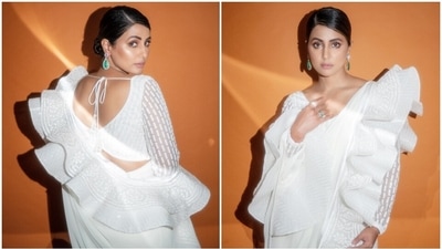 Hina Khan poses in a white ruffled saree with a sleeve. (Instagram) Hina Khan poses in a white ruffled saree with a sleeve. (Instagram)