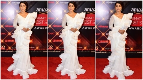 Hina Khan walks the red carpet at Lokmat Most Stylish Awards 2022 in white ruffled saree. (HT Photo/Varinder Chawla) Hina Khan walks the red carpet at Lokmat Most Stylish Awards 2022 in white ruffled saree. (HT Photo/Varinder Chawla)